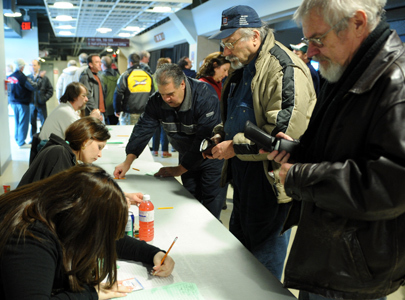 Autoworkers vote on the proposed cost-cutting agreement between the Canadian Auto Workers union and General Motors Canada, at a CAW membership meeting in Oshawa, March 10, 2009.