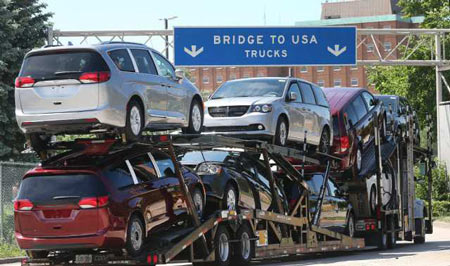 A truck loaded with Chrysler Pacifica models makes its way onto the Ambassador Bridge in Windsor, ON. on Monday, June 11, 2018. (DAN JANISSE/THE WINDSOR STAR) 