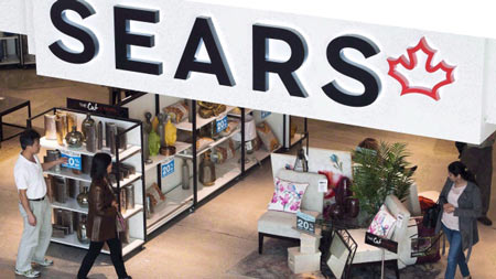 Shoppers enter and leave a Sears retail store in Toronto in October 2017. The Superior Court is appointing a litigation investigator to review $3 billion in payments made to sears shareholders.